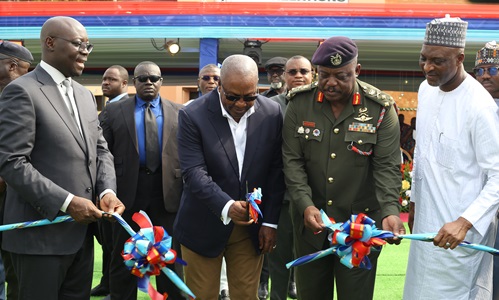 President John Dramani Mahama (2nd from left) cutting the ribbon to commission vehicles for the Ghana Armed Forces. Helping him are Dr Cassiel Ato Forson (left), acting Defence Minister, Lt Gen. William Agyapong (2nd from right), CDS, and Muntaka Mohammed-Mubarak (right), Interior Minister. Picture: BENEDICT OBUOBI