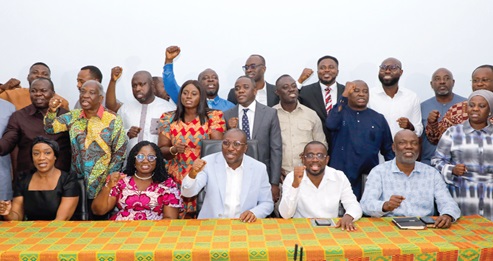 Alexander Afenyo-Markin (seated middle), Minority Leader, and some members of the Minority Caucus in Parliament singing a solidarity song at the press conference. Among those with him is Patricia Appiagyei (seated 2nd from left), Deputy Minority Leader. Picture: ELVIS NII NOI DOWUONA 