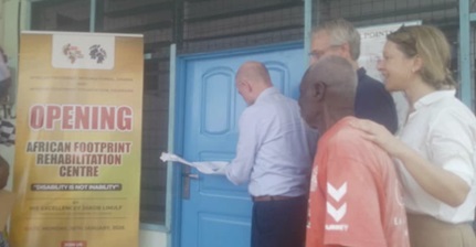 Jakob Lunulf, Danish Ambassador to Ghana,  cutting the tape to inaugurate the facility