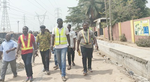  Ernest Norgbey (2nd right) leading some Assembly Members on a tour of ongoing construction works in the constituency.