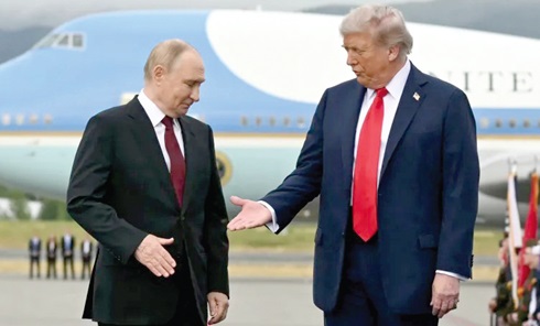 US President Donald Trump, right, reaches out to shake hands with Russian President Vladimir Putin.