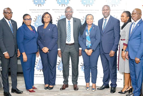 Chief Doli-Wura Zakaria (4th from left), MD, NIB, Belinda Boamah (3rd from left), Deputy MD, Business and Operations, and Thomas Hughes Amissah (3rd from right), Deputy MD, Support Services. With them are Mohamed Gausu (right), Chief Finance Officer, Osman Soale Atchulo (left), Chief Treasury Officer, and other key management staff