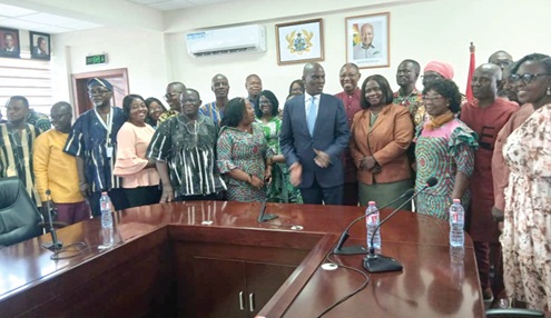 Haruna Iddrisu (arrowed), Minister of Education, assisted by Dr Clement Apaak (behind), Deputy Minister of Education, with some heads of Special Schools and some members of the disability community