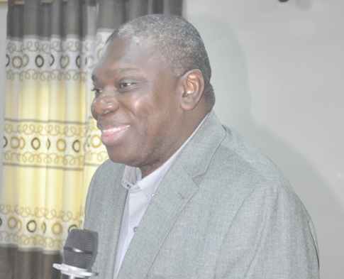 Michael Harry Yamson (left), Administrator of the District Assemblies Common Fund, addressing the meeting