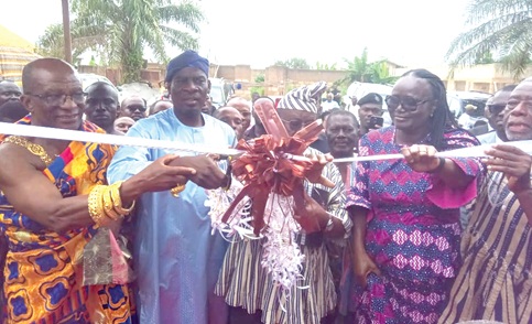 Haruna Iddrisu (2nd from left), Minister of Education, being assisted by Dr Paul Kofi Fynn (2nd from right), Chancellor, Winsconsin International University College, and Professor Rita Akosua Dickson (right), VC, KNUST, to cut the tape to inaugurate the new students hostel