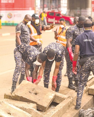 Personnel of the Ghana Police Service joined hands with community members to clear piled-up waste at Circle, Accra