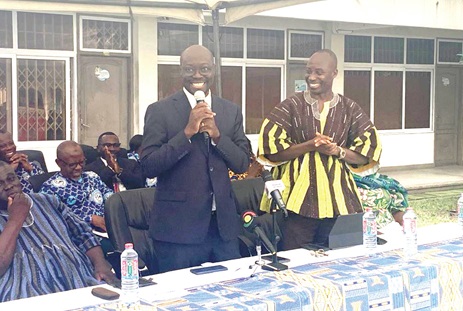Dr Cassiel Ato Baah Forson (middle), Minister of Finance, addressing staff of the Ghana Statistical Service, as Dr Alhassan Iddrisu (right), Government Statistician, looks on