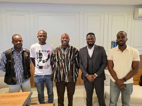 Samson Deen (middle), President of  National Paralympic Committee with the four journalists