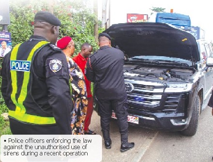 Police officers enforcing the law against the unauthorised use of sirens during a recent operation