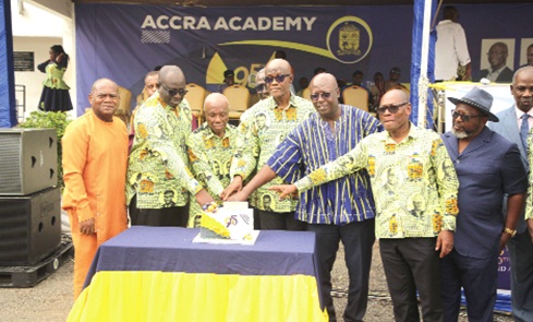 Archie Hesse (3rd from right), former CEO of GhIPSS, with Justice Victor Jones Mawulom Dotse (3rd from left), Chairman of the Accra Academy Board of Governors, and other dignitaries, cutting the anniversary cake. Picture: CALEB VANDERPUYE 
