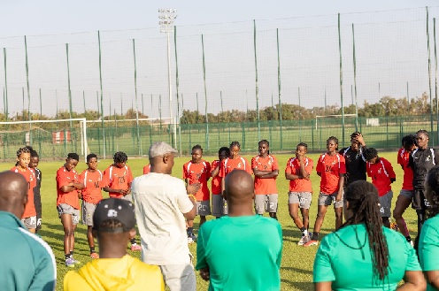 Kofi Iddie Adams (middle) interacting with the team during the visit