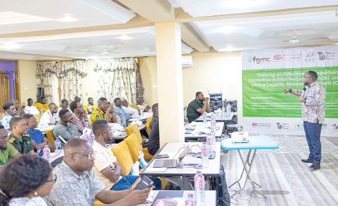 Dr Frank Ankomah (right), Verification Manager, Timber Validation Department, addressing the audience
