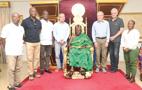 Osagyefuo Amoatia Ofori Panin (seated), the Okyenhene, with Guangzhe Chan (4th from left), Vice-President,  World Bank Group in charge of Planet, and other members of the delegation