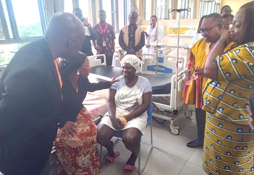 Dr Grace Ayensu-Danquah (2nd from left), Deputy Minister of Health, interacting with an obstetric fistula patient awaiting surgery while Dr Wilfred Ochan (left), UNFPA Country Representative to Ghana, Dr Mark Kurt Nawaane (2nd from right), Chairman, Parliamentary Select committee on Health, and Patricia Appiagyei, MP for Asokwa Constituency, look on