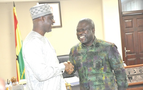 Muntaka Mohamed-Mubarak (left), Minister for the Interior, and James Gunu, Volta Regional Minister, in a hearty handshake