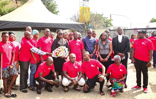 The legal team with some of the disaster victims. Picture: CALEB VANDERPUYE