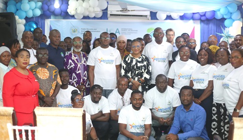 Dr Helena Asamoah-Hassan (arrowed), Executive Director, African Library and Information Associations and Institutions, with Greogry Septimus Setse (5th from right), Director, PRAAD, and other guests after the symposium. Picture: BENEDICT OBUOBI
