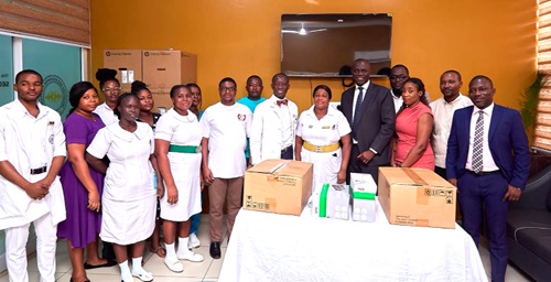 Henry Bukari (4th from right), Managing Director, Phoenix Insurance, Dr Patrick Bankah (6th from right), Head of Department of Surgery and Consultant Neurosurgeon, KorleBu Teaching Hospital, and others after the donation