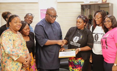 Ivy Safoa Forson (3rd from right), Principal Administrator, National Malaria Elimination Programme, Ghana Health Service, presenting a certificate of recognition to Theophilus Yartey (3rd from left), Editor, Graphic, after the meeting. With them are Eunice Mintah- Agyemang (right), SBC Specialist; Delphine Dede Agbaglo (2nd from right), Private Sector Focal person, and some Editors of the Graphic Communications Group Ltd Picture: EDNA SALVO KOTEY