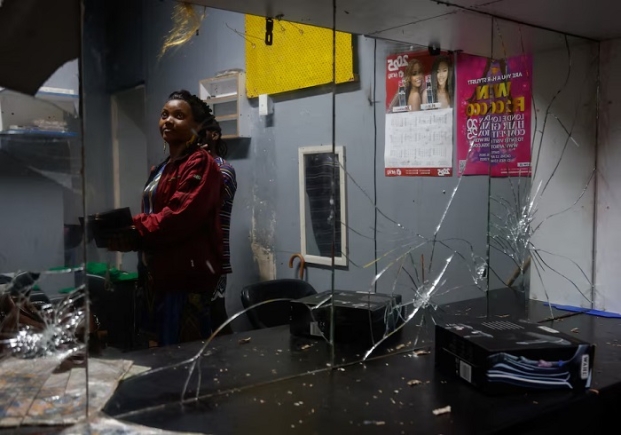 33-year-old Princess Adjei stands in her salon, which was destroyed in a xenophobic attack on May 18, in Durban, South Africa, June 9, 2026. REUTERS/Rogan Ward
