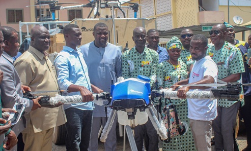 Eric Opoku (left), Minister of Food and Agriculture, and John Dumelo (3rd from left), his deputy, presenting the farm drones and other agricultural products to the Peasant Farmers Association of Ghana. Picture: ERNEST KODZI