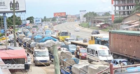 Tricycles compete with vehicles from the Kasoa-Accra section at Mangoline. Pictures: DOUGLAS ANANE-FRIMPONG &amp; ERNEST KODZI