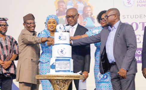 Kwasi Agyei (3rd from right), Controller and Accountant General, being assisted by Cynthia Amerley Amarteifio (2nd from right), Board Chairperson, Students Loan Trust Fund; Dr Emmanuel Newman (right), Director of Tertiary Education Division, Ministry of Education, and Dr Hajia Saajida Shiraz (3rd from left), Chief Executive Officer, Students Loan Trust Fund, to cut the cake to mark the 20th anniversary of the Students Loan Trust Fund. Picture: ELVIS NII NOI DOWUONA 