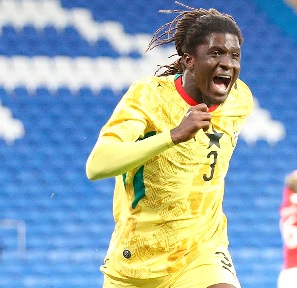 Caleb Yirenkyi celebrates his opening goal for the Black Stars against Wales in Cardiff yesterday