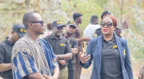 Justina Nelson (right), CEO, MIIF, in a chat with Seth Ntiamoah-Asare Jnr, MD of Regimanuel Concrete Products Ltd., during a tour of the quarry site