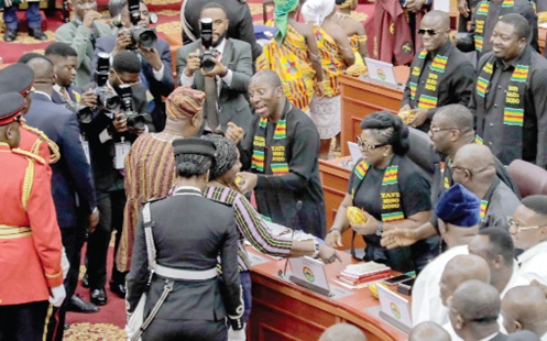President John Mahama (back to camera) talking with Alexender Afenyo-Markin, the Minority Leader