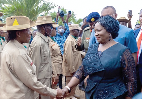 Vice-President Prof. Opoku-Agyemang shaking hands with an ex-servicewoman at the anniversary