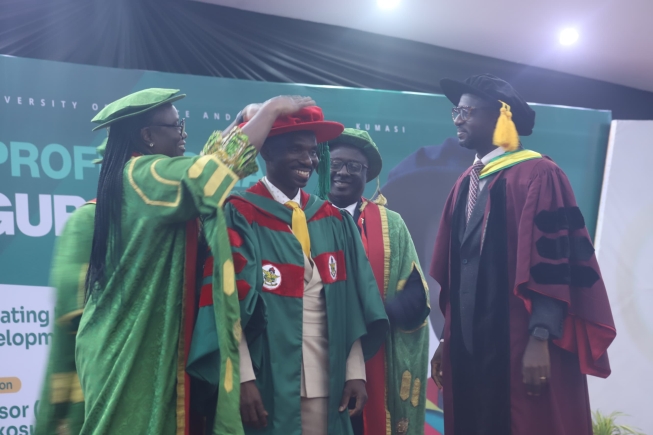 Prof Prince Osei-Wusu Adjei, being decorated  by Prof Mrs Rita Akosua Dickson(left),Vice Chancellor, KNUST , after delivering an address at a Professorial Inaugural lecture held in Kumasi. Those with them include Benjamin Boampong Owusu(right), Registrar, KNUST.