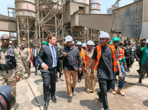 Mr Frederic Albrecht, Managing Director of CBI Ghana Ltd conducting President John Dramani Mahama and other dignataries round the plant
