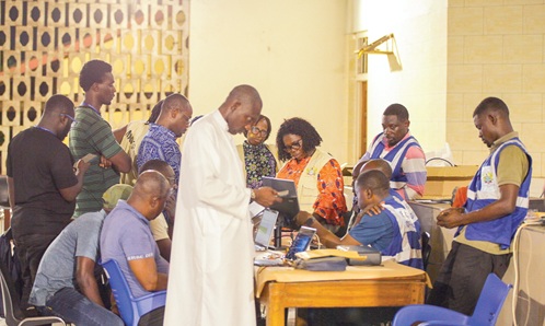 Officials of the EC collating results Officials of the EC collating results