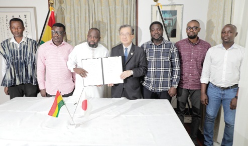 Hiroshi Yoshimoto (middle), Japan Ambassador to Ghana, with Mahadi Alhassan (3rd from left), CEO, EduGha Organisation; Bilal Taimako Shamsudeen (3rd from right), Deputy CEO, EduGha Organisation, and some members of the community after signing the grant contract. Picture: ELVIS NII NOI DOWUONA 