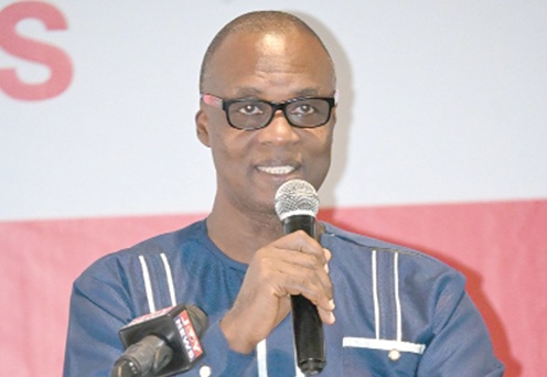 Nii Doodo Dodoo (right), Country Director of the British Council, addressing participants in the exhibition