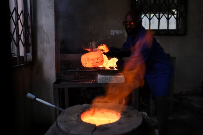 A worker smelts gold at a facility in Accra, Ghana August 22, 2024. REUTERS/Francis Kokoroko