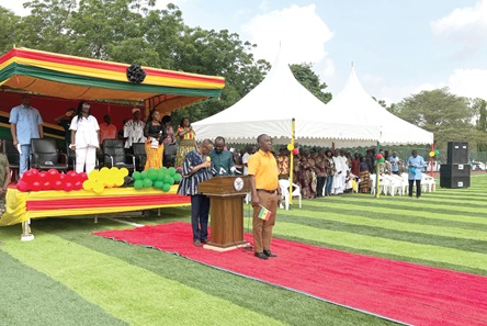 Musah Kalamu Adamu (arrowed), MCE for Ablekuma North, in public school uniform  taking the salute during the parade 