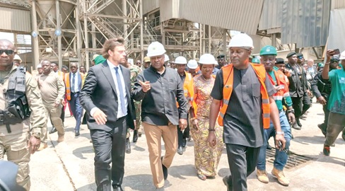 Frederic Albrecht (2nd from right), Managing Director, CBI Ghana Ltd, conducting President John Dramani Mahama  (2nd from left) and other dignitaries round the plant. With them is Elizabeth Ofosu-Adjare (4th from right) Minister, Trade Agribusiness and Industry