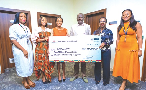 Christabel Sewornu (2nd from right), Chief Human Resource Manager, FuelTrade, presenting the dummy cheque to Paul Adjei (3rd from right), GETFund Administrator, while Adwoa Amankwaah Boateng Appiah,  Head of GETFund EFPI, looks on