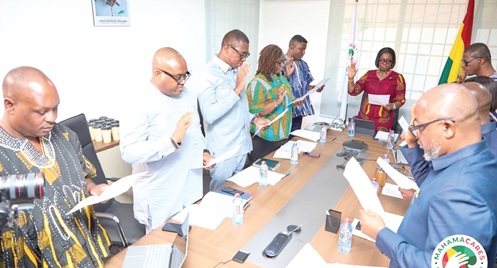 Members of the Tender Equity Committee of the Ghana Medical Trust Fund taking the oath at the swearing in ceremony in Accra