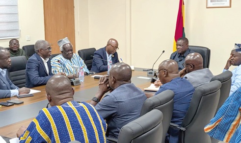 Kwame Governs Agbodza (right), Minister of Roads and Highways, speaking at the meeting. With him are Dr Gameli Kewuribe Hoedoafia (left), Executive Secretary, IMCC and  Prof. Kwamina Ahwoi (2nd from left)