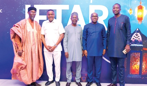 Kwamina Asomaning (2nd from right) and Musah Abdallah (2nd from left) with some Stanbic Muslim clients at the event