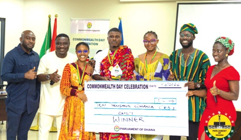 Titus Owusu Darko (4th from right), Precious Akos Agrobesa (3rd from right) and Dorothy Nkansah Agyapomaa (3rd from left), the three contestants joined by some of their colleagues to pose with the winning dummy