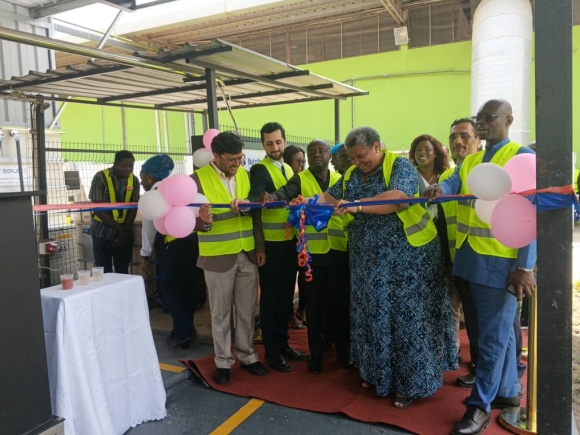 Mrs Gizella Tetteh-Agbotui(4th right) being assisted by Mr. Jay Anjaria, (left) Business and Country Head of Nutrifoods Ghana Limited and other dignataries to cut the ribbon at the inauguration of the facility.