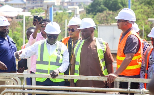Kenneth Gilbert Adjei (middle), Minister of Works, Housing and Water Resources; and Adam Mutawakilu (right), Managing Director of the Ghana Water Limited, being briefed by Dr Hadisu Alhassan (left), Production Manager for ATMA Production Area, during the visit. Picture: CALEB VANDERPUYE