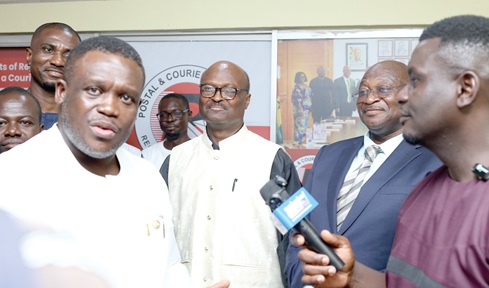 Samuel Nartey George (left), Minister of Communication, Digital Technology and Innovations, seeking clarification during the visit to the monitoring room. With him are Cosmas Anpengnuo (2nd from right), acting Executive Secretary, Postal &amp; Courier Services Regulatory Commission, and Bishop Francis Afotey Odai (2nd from left), Chairman, PCSRC