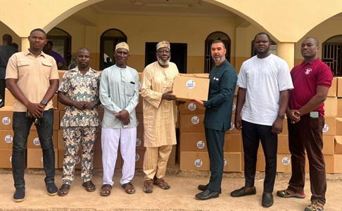 Mouhamad Hamidi (3rd from right), Head of Salaam Ghana, presenting the items to  Alhaji Mahama Yussif Afanla, Wangara Chief of Madina, alongside other dignitaries