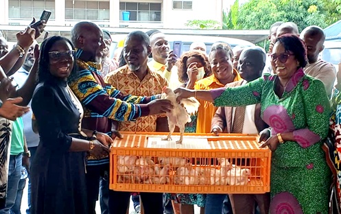 Rita Akosua Adjei Awatey (right), the Eastern Regional Minister, presenting some of the Nkoko Nketenkete to the Municipal Chief Executive (MCE) for New Juaben South as part of the launch.