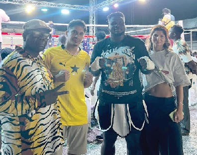 Victorious boxer, John Antwi, celebrates with Coach Ofori Asare (left) and supporters after the fight